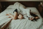 woman lying on bed