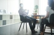 Two people discussing in a bright office